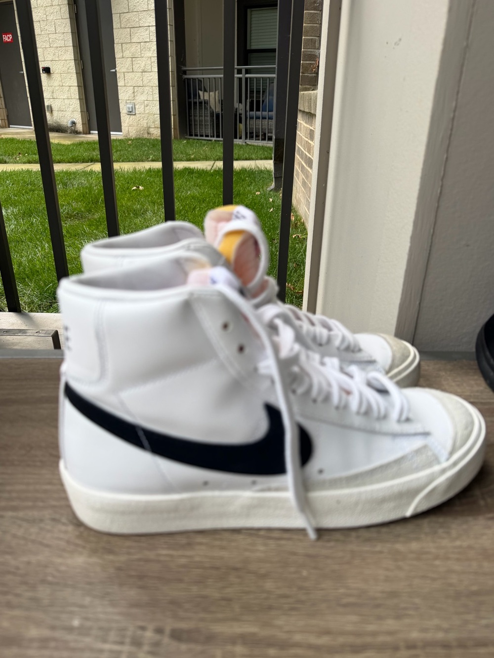 Nike White High-Top Sneakers with Pink Tongue and Yellow Heel Tab